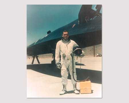 A photograph of an A-12 pilot pictured next to an aircraft.